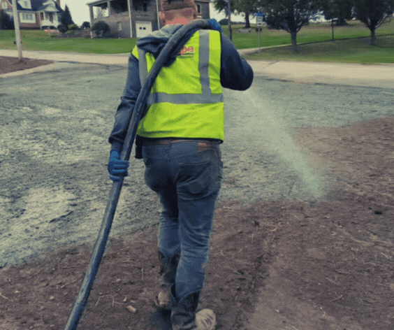 TruScape technician spraying hydroseed