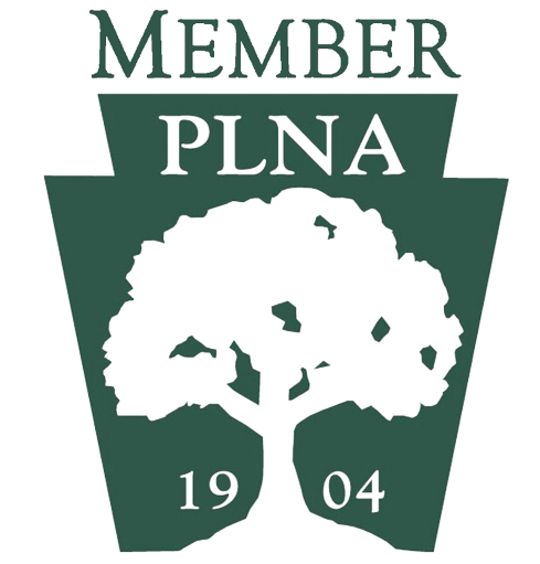 PLNA member logo with a tree silhouette and the year 1904.