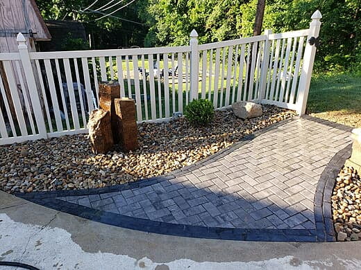 A comfortable walkway with pondless water feature